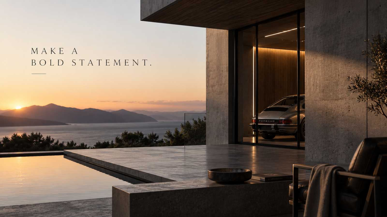 An exceptional concrete and glass home at sunset, with a performance car visible through the garage.